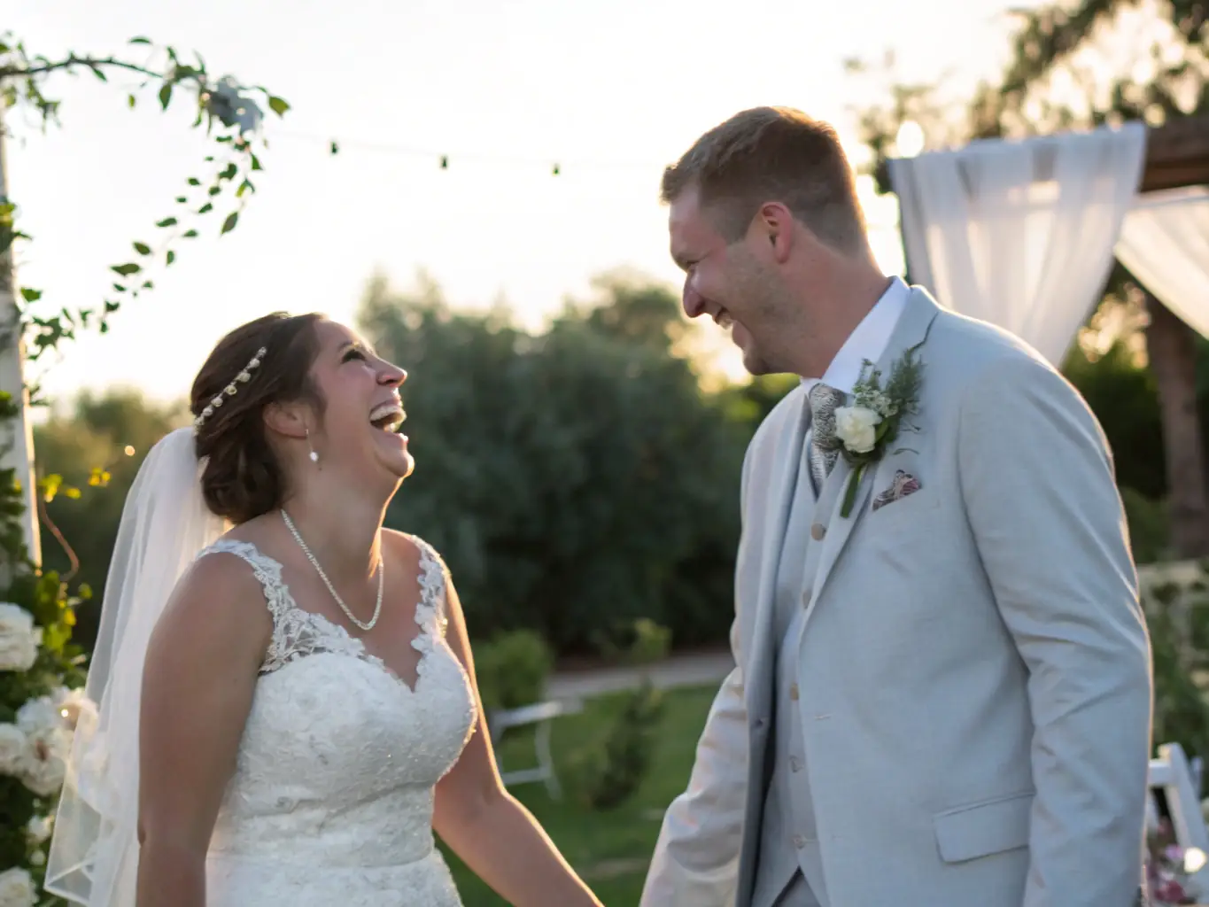 A newlywed couple shares a tender moment in a horse-drawn carriage, adorned with flowers and ribbons, as they ride through a picturesque park after their wedding ceremony.